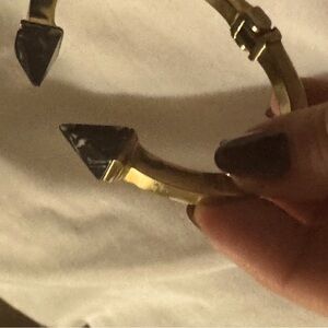 Edgy gold bangle accommodates small wrist circa 6” Hermes clic clac or teensier